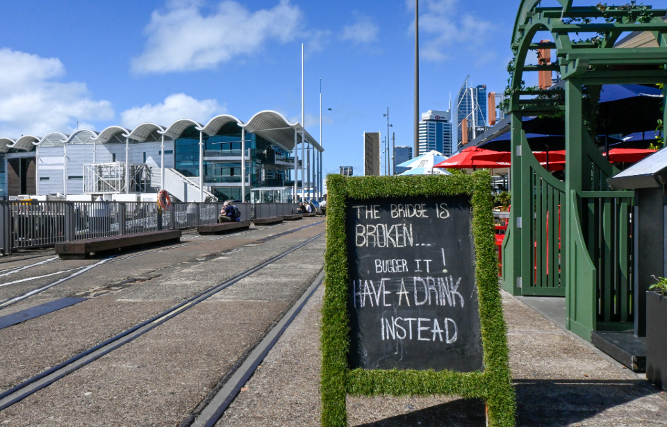 “Every cloud has a silver lining". A billboard lies outside The Conservatory, one of the Wynyard Quarter restaurants affected by the closure of the walkway. Staff refused to comment on how the empty tables reflect slow business.  Photo: Vivek Panchal 