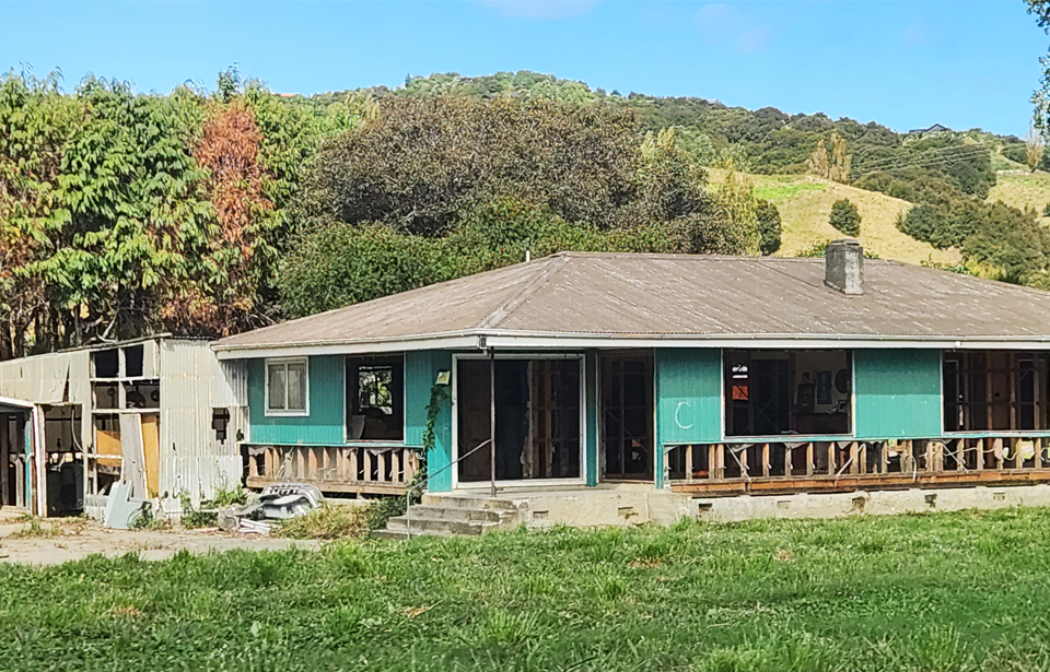 The shells of many houses damaged by Cyclone Gabrielle’s flooding remain in Eskdale. Photo: Rosa Katavich 